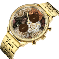 Mahogany Rose watch featuring a gold-tone case, floral dial with roses, and a gold metal bracelet.