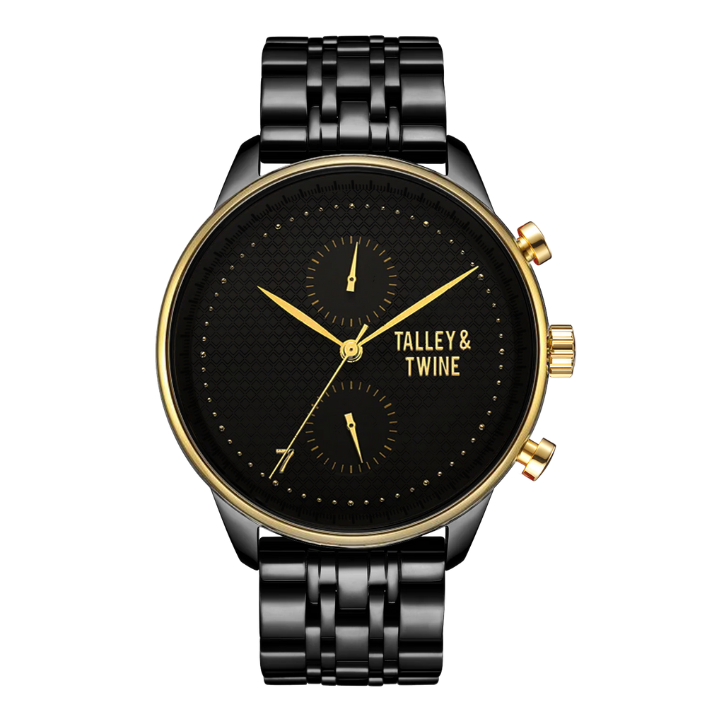 Pharaoh watch featuring a black dial, gold accents, and a black metal bracelet on a red background.