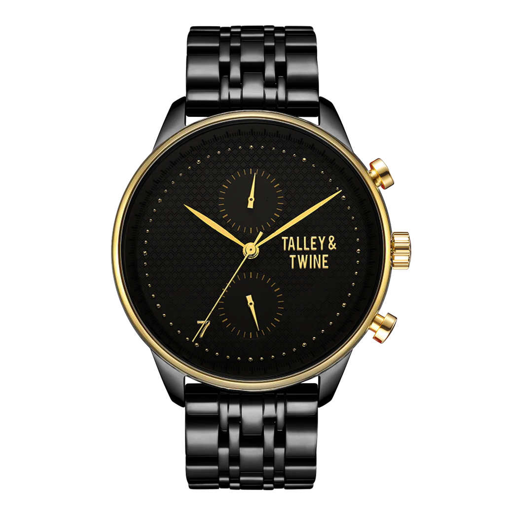 Pharaoh watch featuring a black dial, gold accents, and a black metal bracelet on a red background.