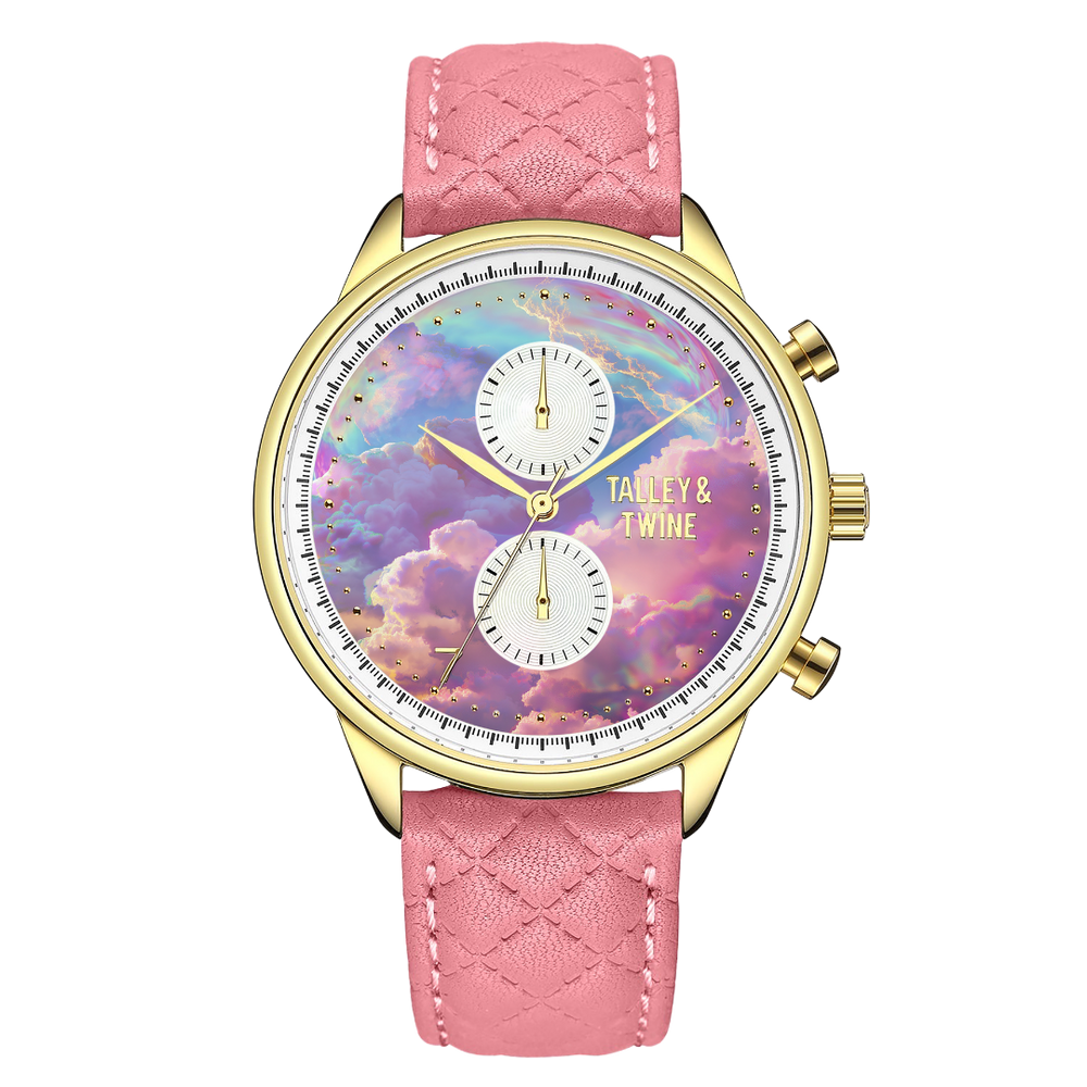 Pink unicorn watch with a gold case, pastel cloud dial, and pink quilted leather strap.