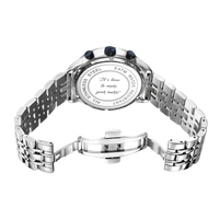 Origins watch with a stainless steel band, blue accents, and engraved back stating "It's time to make your mark.