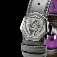 Close-up of a watch with a detailed emblem on a black background, Talley & Twine